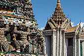 Bangkok Wat Arun - the statues of the mythical  demon bears  that support the different levels of the prang.